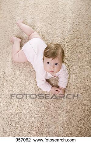 A baby looking up, portrait View Large Photo Image Stock Image - A baby looking up, portrait. Fotosearch