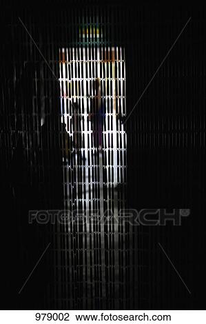Stock Image - A beaded curtain hanging in front of a doorway. Fotosearch