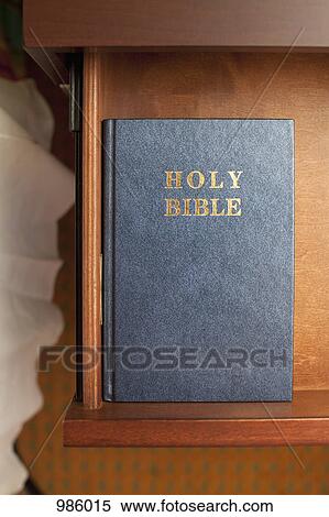 A bible in a night table drawer in a hotel room View Large Photo Image Stock Photography - A bible in a night table drawer in a hotel room. Fotosearch