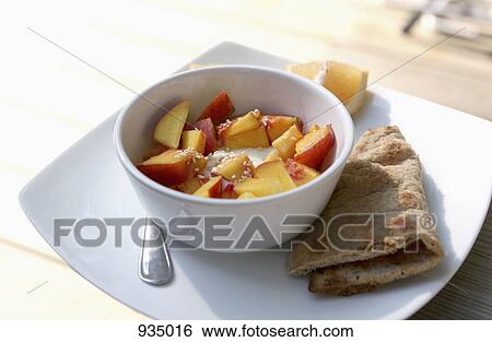 A bowl of yogurt with fresh nectarines View Large Photo Image Stock Photograph - A bowl of yogurt with fresh nectarines. Fotosearch