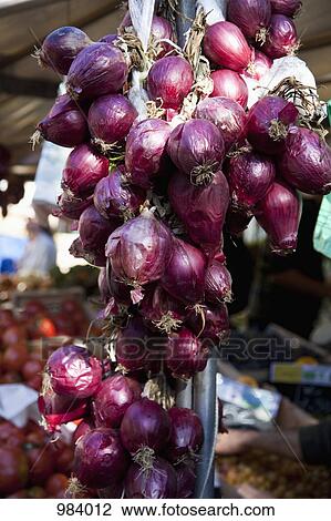 A bunch of red onions at an outdoor market View Large Photo Image Stock Image - A bunch of red onions at an outdoor market. Fotosearch