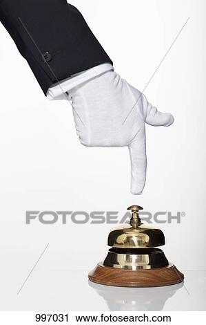 A butler pushing a service bell, focus on hand View Large Photo Image Stock Image - A butler pushing a service bell, focus on hand. Fotosearch