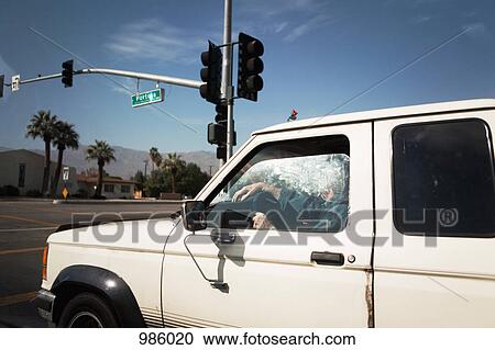 Stock Image - A car stopped at an intersection. Fotosearch