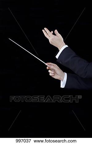 A conductor conducting, focus on hands View Large Photo Image Stock Photo - A conductor conducting, focus on hands. Fotosearch