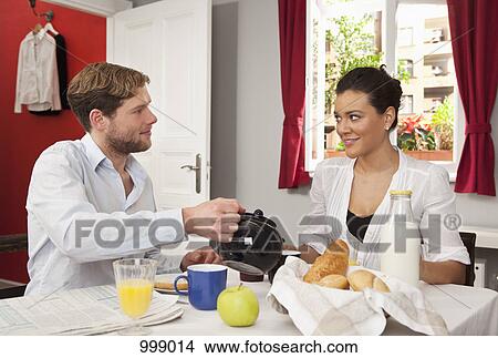 A couple having breakfast View Large Photo Image Picture - A couple having breakfast. Fotosearch