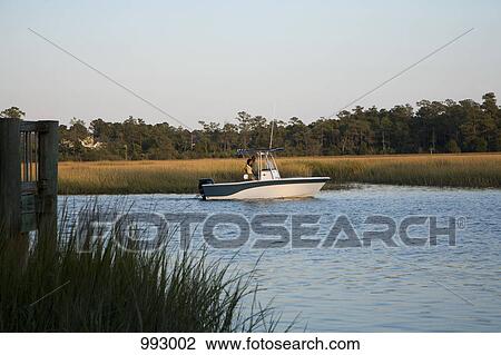 A couple out on their boat View Large Photo Image Stock Image - A couple out on their boat. Fotosearch