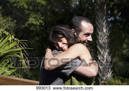 A couple tightly hugging View Large Photo Image Stock Image - A couple tightly hugging. Fotosearch