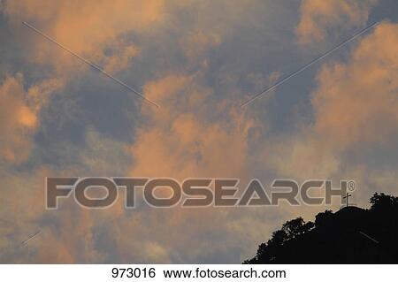 A cross on a hilltop at dusk View Large Photo Image Stock Photograph - A cross on a hilltop at dusk. Fotosearch