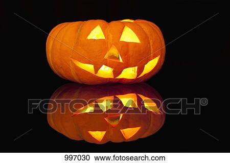 A glowing jack-o-lantern View Large Photo Image Stock Image - A glowing jack-o-lantern. Fotosearch