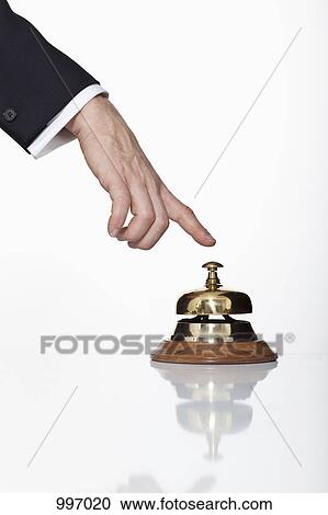 A man pressing a service bell, focus on hand View Large Photo Image Stock Image - A man pressing a service bell, focus on hand. Fotosearch
