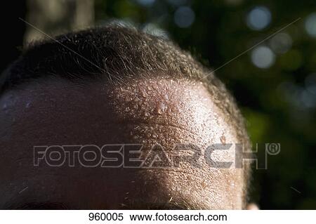 A man sweating, detail of forehead View Large Photo Image Stock Photography - A man sweating, detail of forehead. Fotosearch