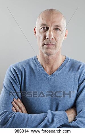 A man with his arms crossed, portrait View Large Photo Image Picture - A man with his arms crossed, portrait. Fotosearch