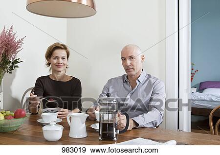 A mature couple having breakfast together View Large Photo Image Stock Photo - A mature couple having breakfast together. Fotosearch
