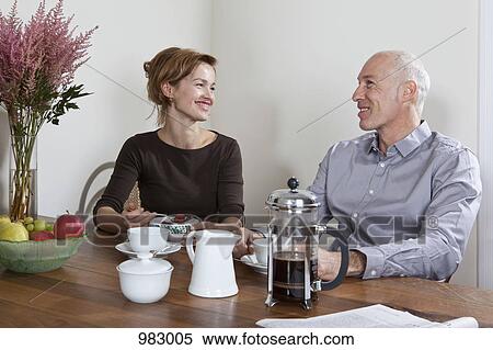 Stock Photography - A mature couple having breakfast together. Fotosearch