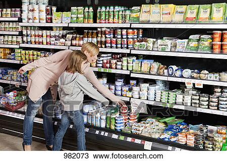 A mother and daughter shopping at the supermarket View Large Photo Image Stock Image - A mother and daughter shopping at the supermarket. Fotosearch
