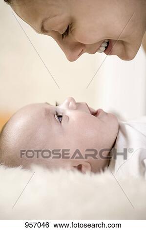 A mother and her baby boy, close-up, face to face View Large Photo Image Stock Photograph - A mother and her baby boy, close-up, face to face. Fotosearch