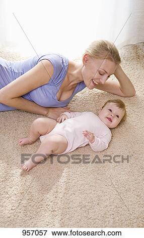 Stock Photo - A mother and her baby daughter. Fotosearch