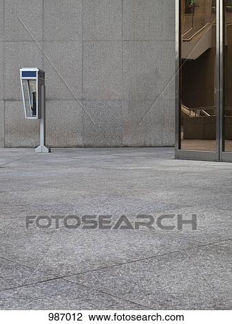 A payphone outside of an office building View Large Photo Image Stock Image - A payphone outside of an office building. Fotosearch