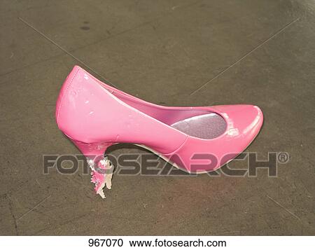 Stock Image - A pink stiletto with bit marks. Fotosearch