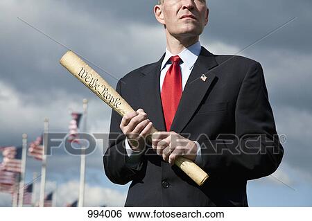 A politician holding a rolled up US Constitution View Large Photo Image Stock Photograph - A politician holding a rolled up US Constitution. Fotosearch