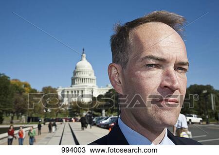Stock Image - A politician in front of the US Capitol Building. Fotosearch