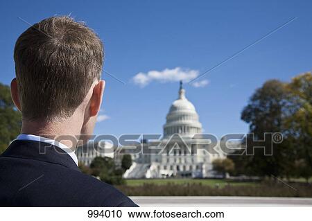 Stock Image - A politician in front of the US Capitol Building. Fotosearch