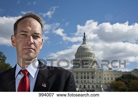 A politician in front of the US Capitol Building View Large Photo Image Stock Photo - A politician in front of the US Capitol Building. Fotosearch