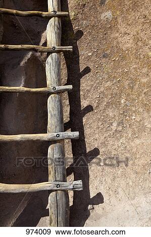 A pueblo ladder leaning up against an adobe wall View Large Photo Image Stock Photo - A pueblo ladder leaning up against an adobe wall. Fotosearch