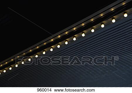 Picture - A row of light bulbs, outdoors. Fotosearch