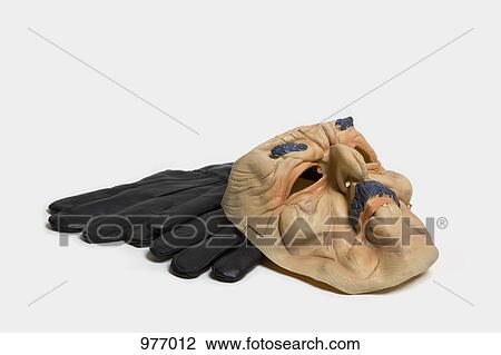 A rubber mask and a pair of gloves View Large Photo Image Stock Image - A rubber mask and a pair of gloves. Fotosearch