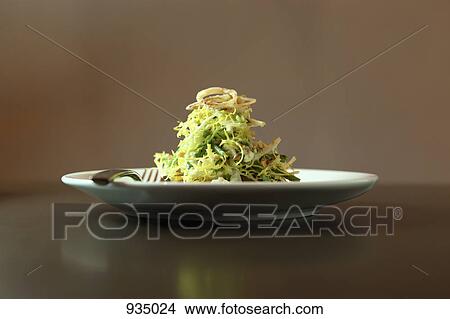 A salad garnished with fried onions View Large Photo Image Picture - A salad garnished with fried onions. Fotosearch