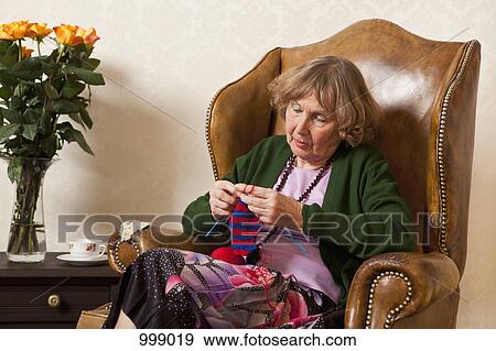 A senior woman concentrating on her knitting View Large Photo Image Stock Photo - A senior woman concentrating on her knitting. Fotosearch