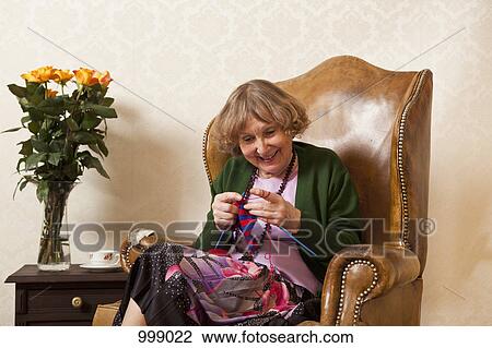 A senior woman enjoying knitting View Large Photo Image Stock Image - A senior woman enjoying knitting. Fotosearch