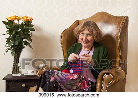 A senior woman knitting View Large Photo Image Stock Photography - A senior woman knitting. Fotosearch