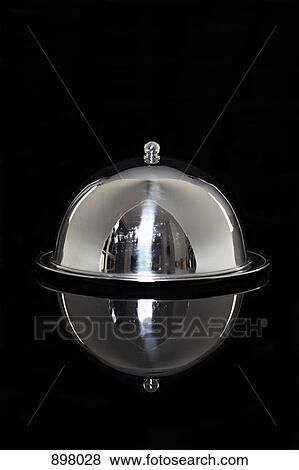 Stock Photo - A silver platter with a lid. Fotosearch