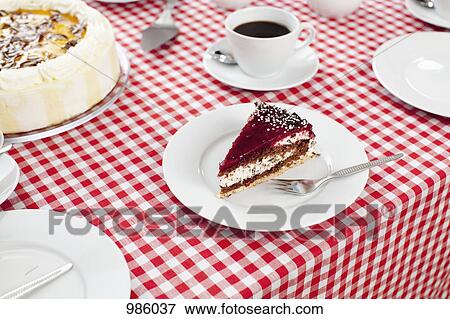 Stock Photo - A slice of cake and cup of coffee. Fotosearch