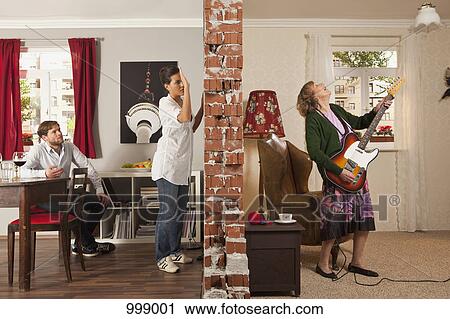 A split screen showing an angry woman pounding on the wall to her neighbor View Large Photo Image Stock Image - A split screen showing an angry woman pounding on the wall to her neighbor. Fotosearch