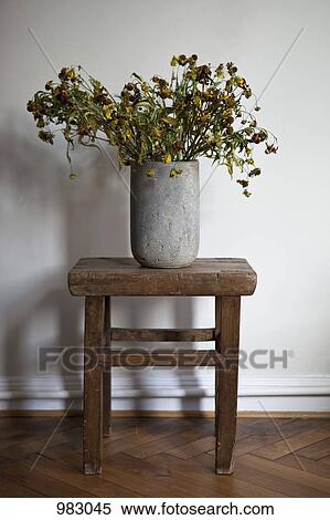 A stone vase full of dead flowers View Large Photo Image Stock Photography - A stone vase full of dead flowers. Fotosearch