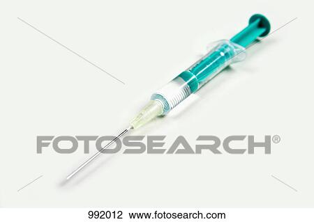 A syringe on a white background View Large Photo Image Stock Image - A syringe on a white background. Fotosearch