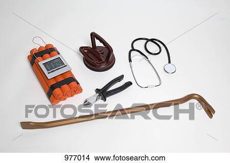 A time bomb next to various tools and equipment View Large Photo Image Picture - A time bomb next to various tools and equipment. Fotosearch