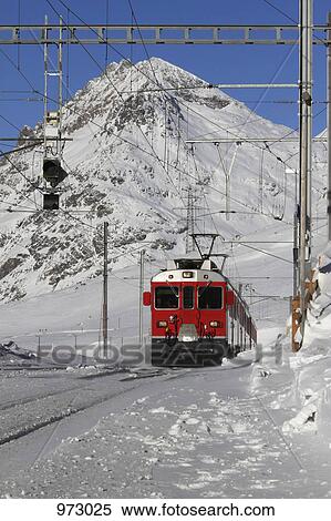 A tram in front of a snowy mountain View Large Photo Image Stock Photography - A tram in front of a snowy mountain. Fotosearch