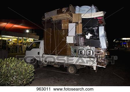 A truck packed with furniture and household items View Large Photo Image Stock Image - A truck packed with furniture and household items. Fotosearch