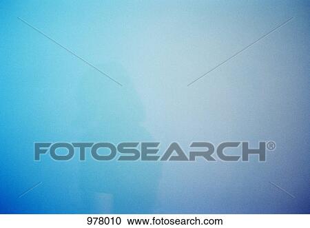 Stock Image - A woman amidst smoke and blue light. Fotosearch