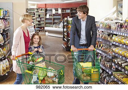 A woman and her daughter chatting with a man in a supermarket View Large Photo Image Stock Photography - A woman and her daughter chatting with a man in a supermarket. Fotosearch