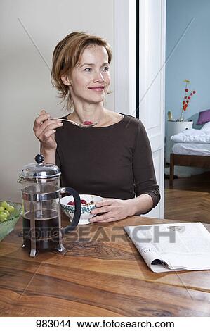 A woman having breakfast View Large Photo Image Picture - A woman having breakfast. Fotosearch