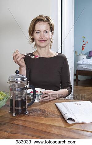 A woman having breakfast View Large Photo Image Stock Image - A woman having breakfast. Fotosearch