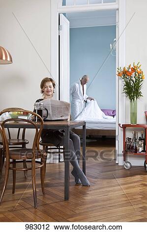 A woman having coffee and reading the newspaper View Large Photo Image Stock Image - A woman having coffee and reading the newspaper. Fotosearch