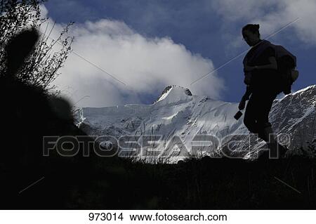 A woman hiking in Switzerland View Large Photo Image Picture - A woman hiking in Switzerland. Fotosearch