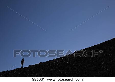 A woman hiking up Lonquimay Volcano, Chile View Large Photo Image Stock Image - A woman hiking up Lonquimay Volcano, Chile. Fotosearch