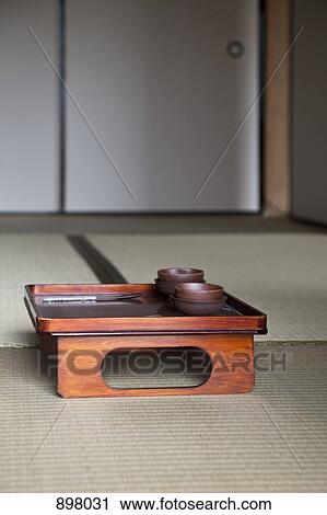 Stock Image - A wooden tray on the floor. Fotosearch